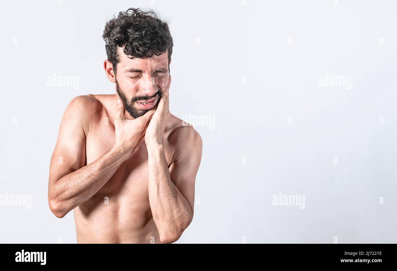 Man with earache on isolated background, ear disease concept, Person with earache on isolated background Stock Photo