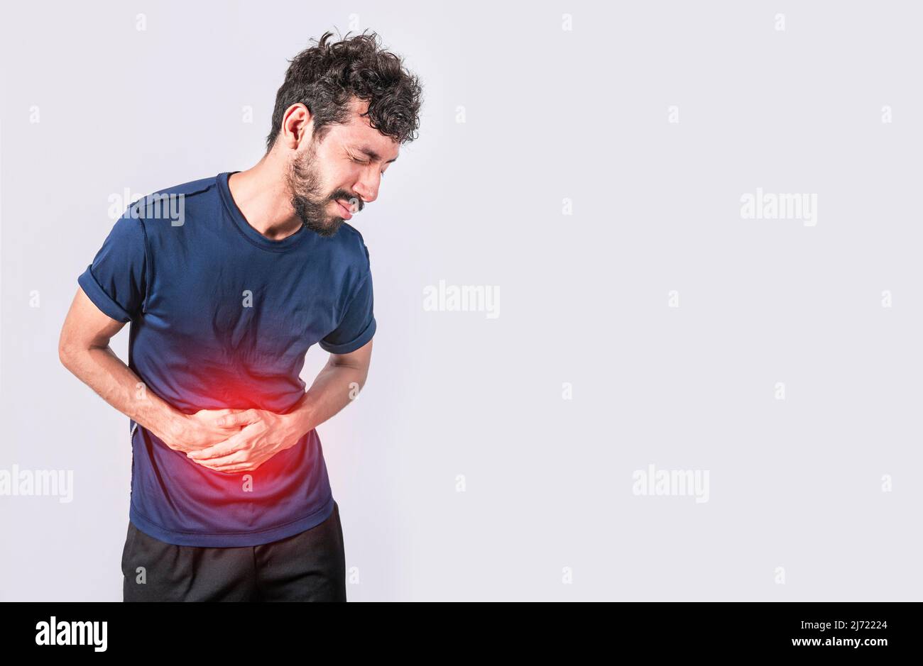 Person with stomach pain, stomach problems concept, man with digestive problems, man with stomach pain, isolated Stock Photo