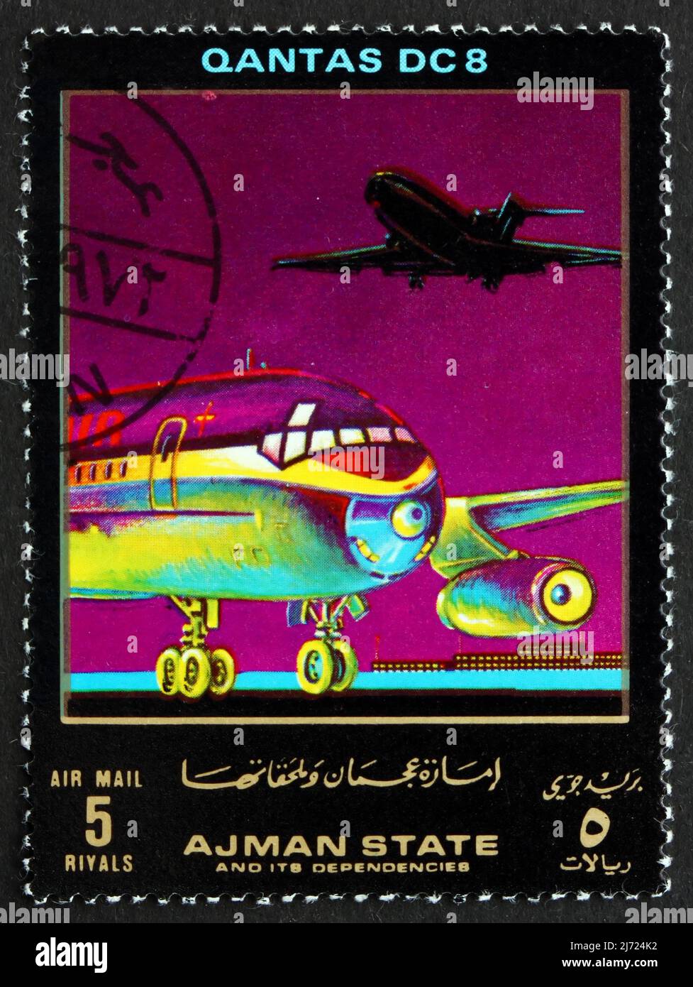 AJMAN - CIRCA 1972: a stamp printed in the Ajman shows DC 8, Quantas, Airliner, circa 1972 Stock Photo