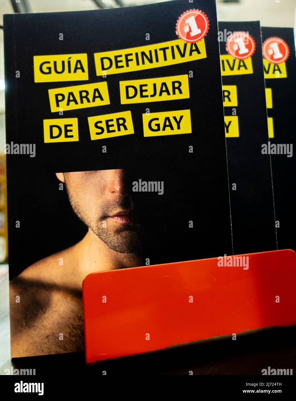 Guía definitiva para dejar de ser gay Broche -the definitive guide to come out as gay - Spanish brochure 2021. Lito Míguez Stock Photo