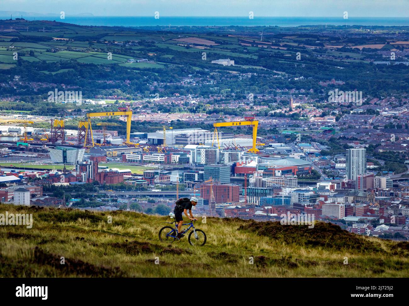A man cycles on the Belfast Hills, Black Mountain, Belfast, Northern Ireland Stock Photo