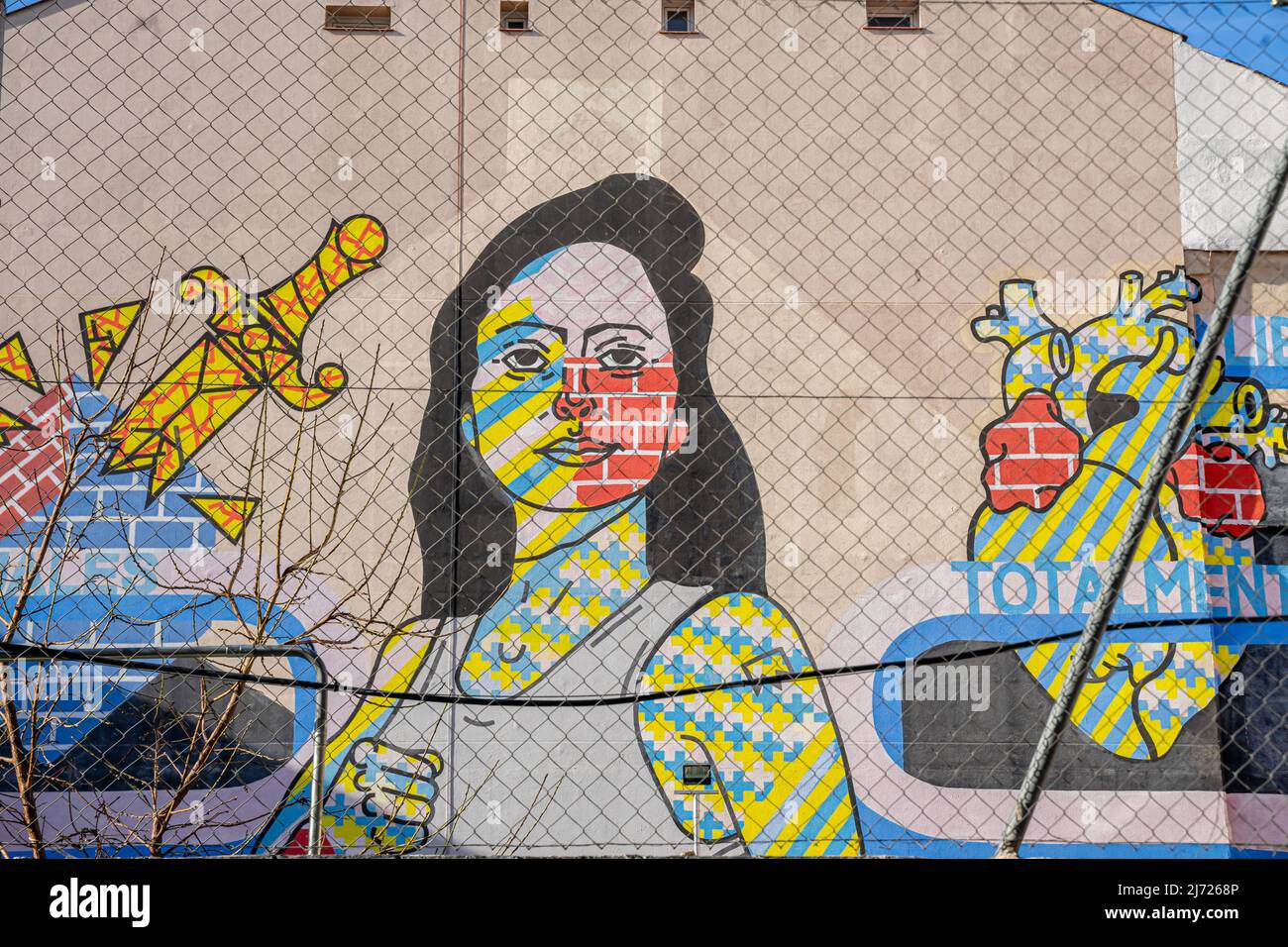 Big feminist mural by Spanish artist Toni Arribas on the wall of building at Calle Embajadores, 16. The large mural is 400 metres. Madrid, Spain Stock Photo