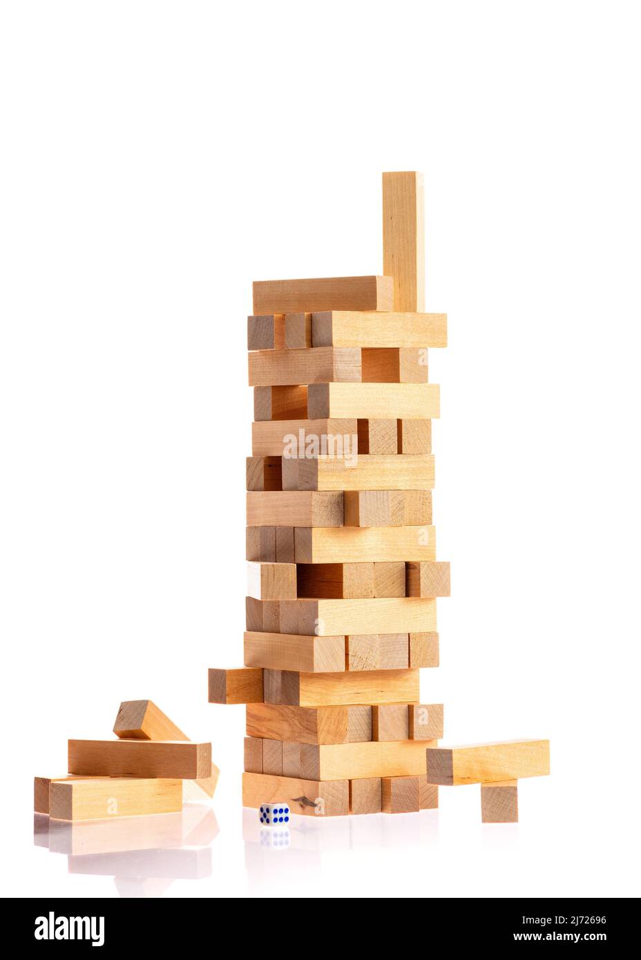 tower made of wooden blocks falling on white background Stock Photo