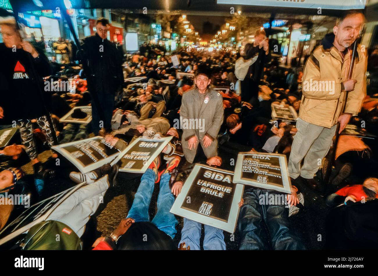 Paris, France, Large Crowd People, Aids Activists, Act Up Paris NGO Staging Die-in, Laying Down on Street in Protest of Dying, World AIDS Day, Dec. 1,  Anti Big Pharma Slogans Stock Photo