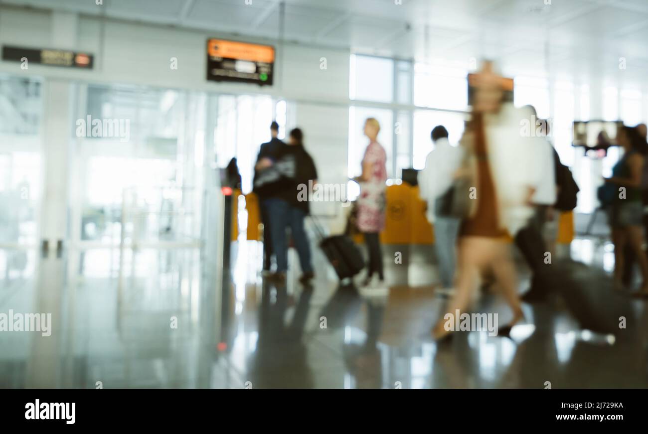 Silhouette of people walking inside airport terminal going to the gate for departure passport check visa control Stock Photo