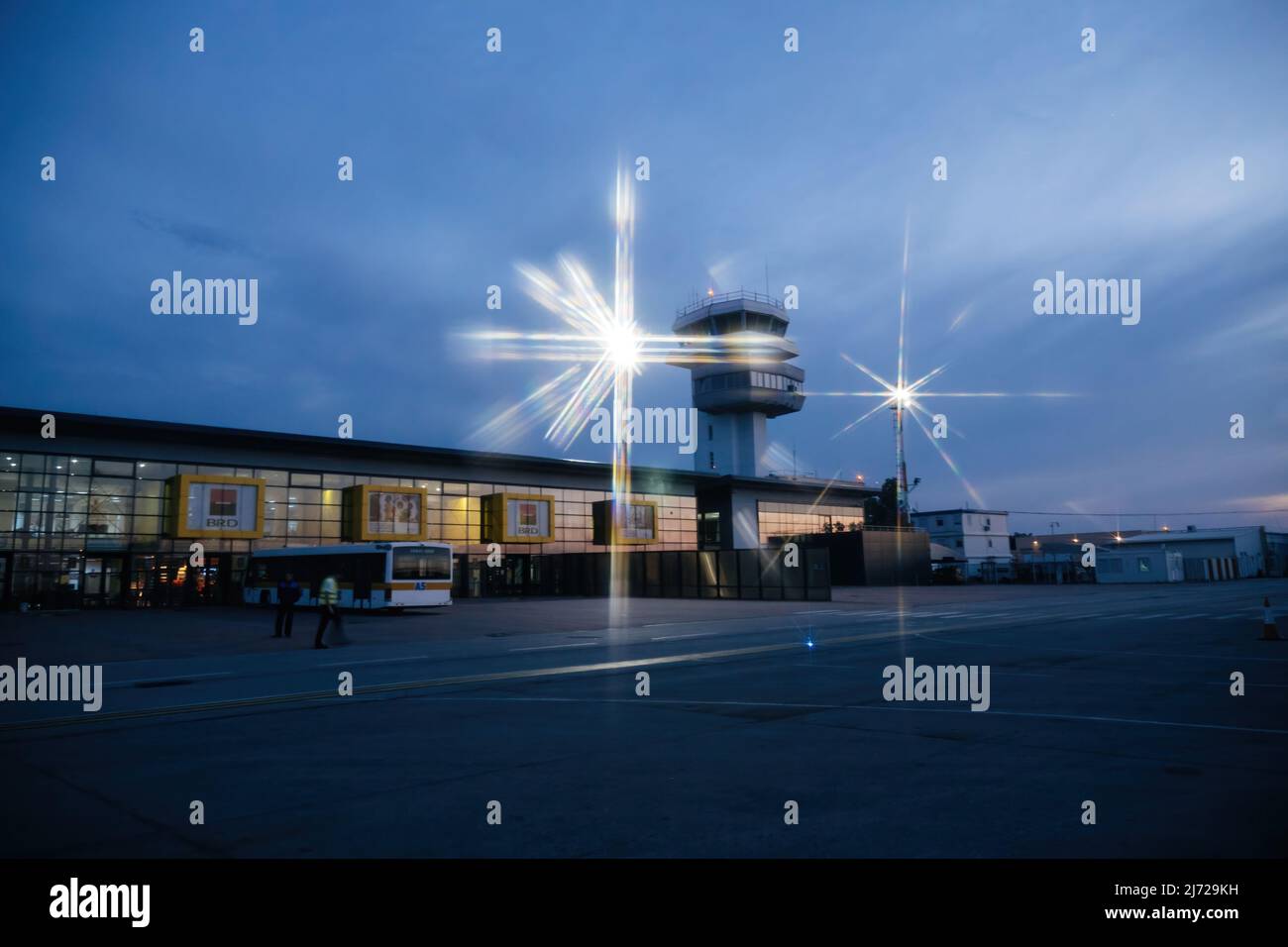 Timisoara, Romania Jun 17, 2015: Arrival area for low cost flights at the Timisoara International Airport Traian Vuia - star filter on the light poles Stock Photo