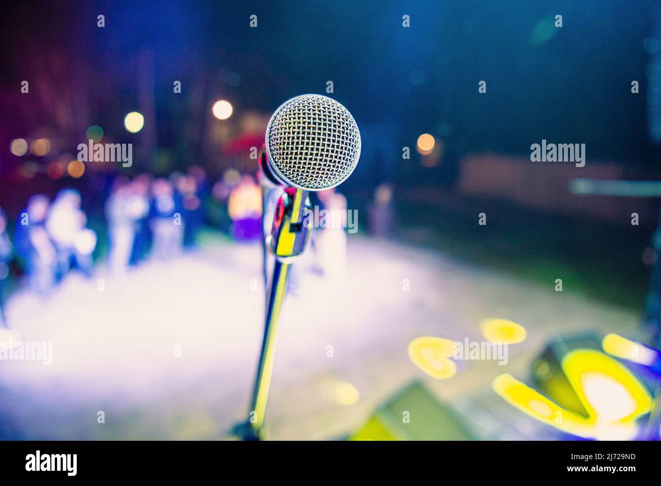 singers microphone on a stand on stage during a concert Stock Photo Alamy