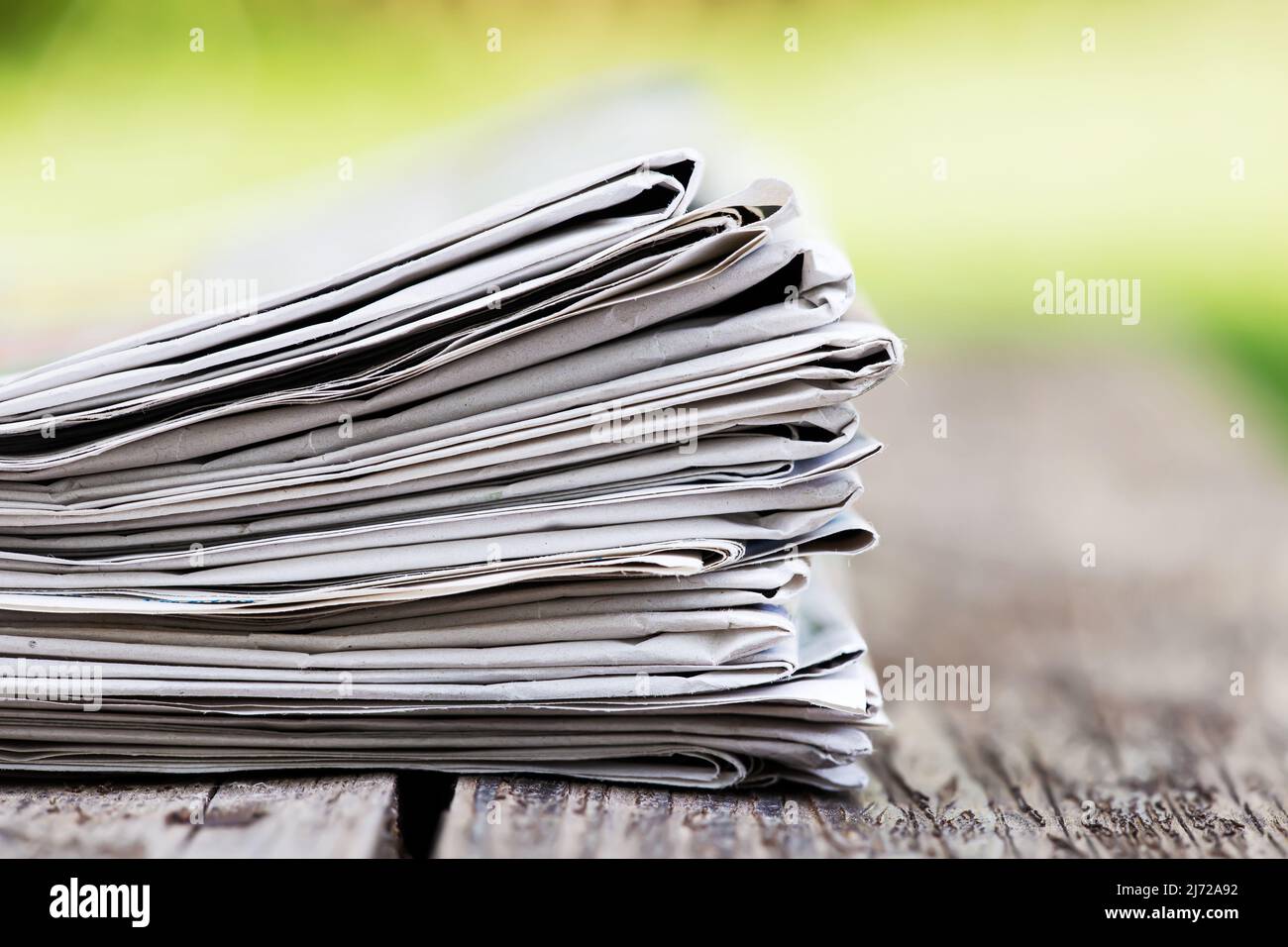 Stack of newspapers on table hi-res stock photography and images - Alamy