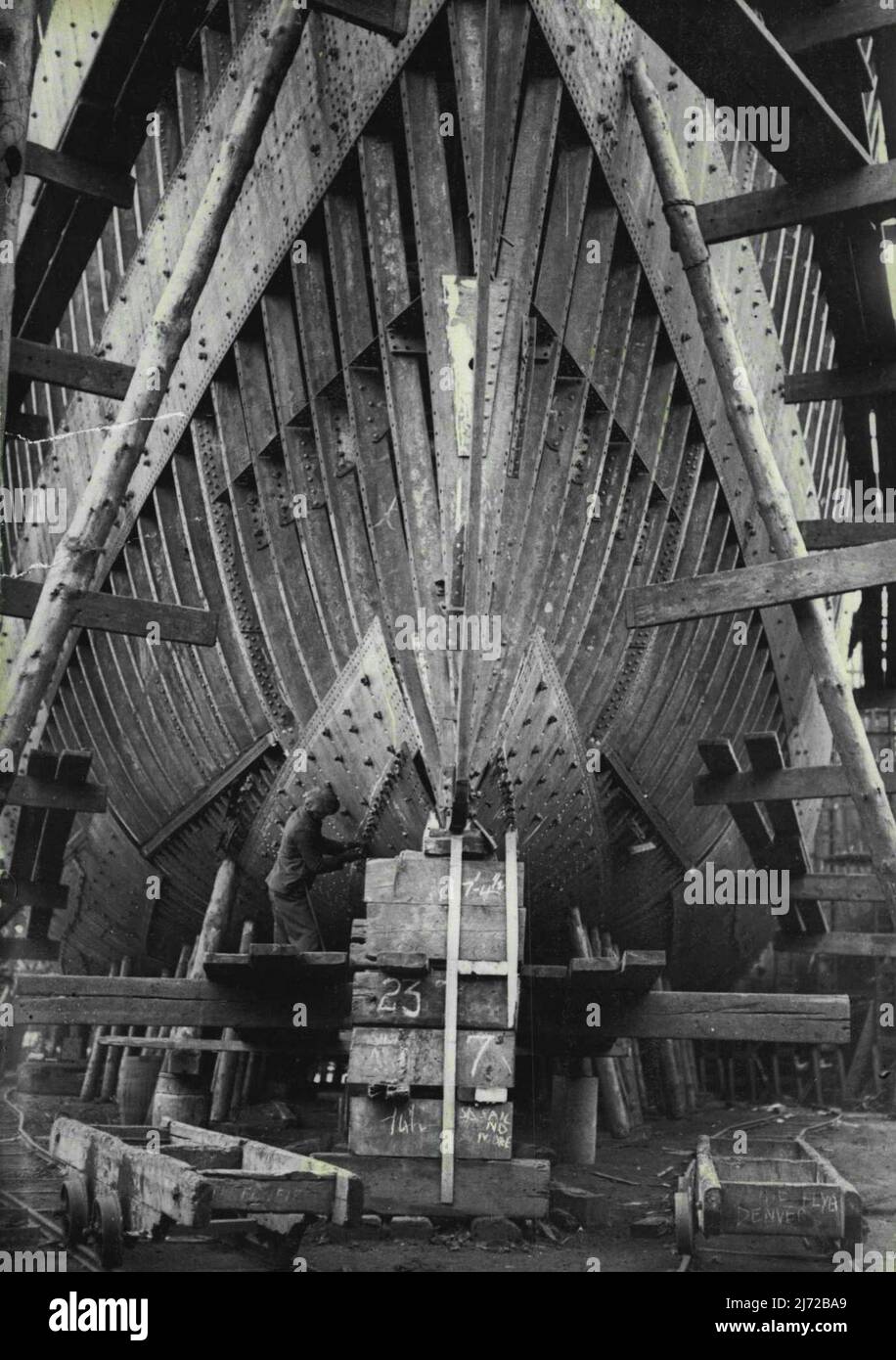 Tightening up the bolts on the bow of a large Cargo ship on the *****. Cargo Vessels are now bring built by a practical approach to Mass production methods. Ship yards are building the types which in each case4 they are most experience in and equipped. May 28, 1940. (Photo by Sport & General Press Agency Limited). Stock Photo