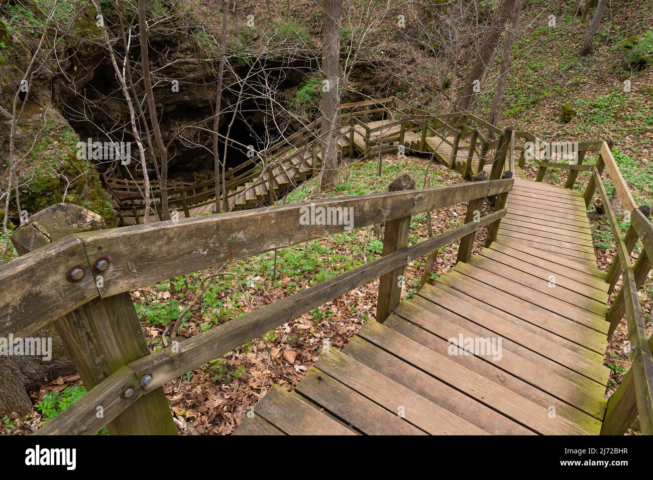 Wooden walkway leading to Dancehall Cave at Maquoketa Caves State Park, Iowa. Stock Photo