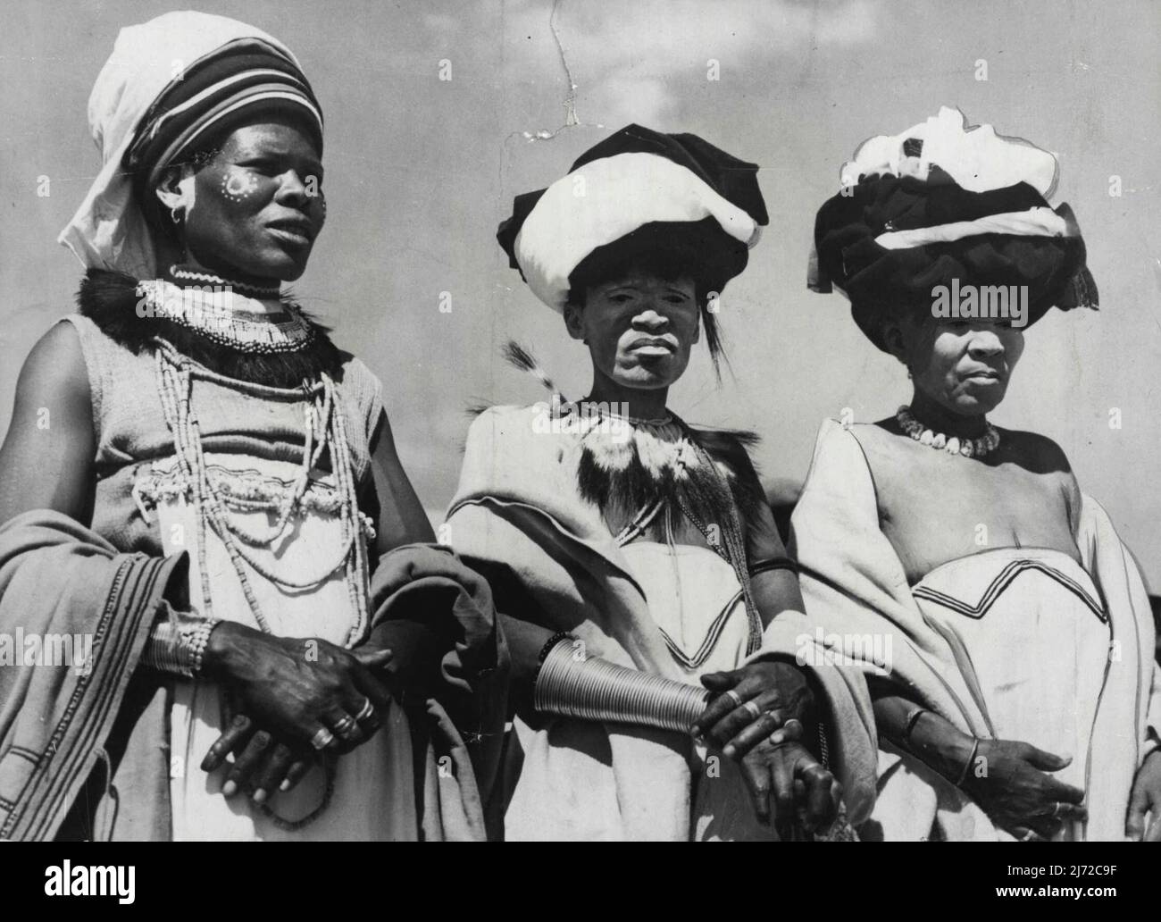 The Royal Tour Fashion Note From South Africa These three picturesque native women in full ceremonial dress were among the thousands of natives who demonstrated their loyalty to the King when the Royal Family paid a visit to the New Brighton native township at Port Elizabeth, Cape Province, South Africa. March 08, 1947. Stock Photo