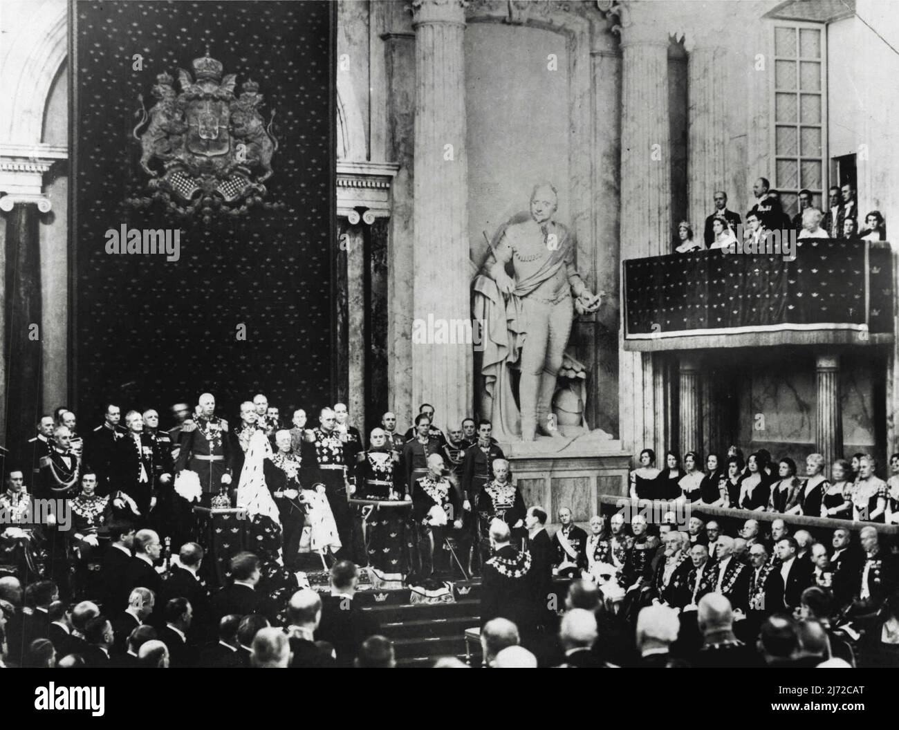 The Opening of The Swedish Parliament -- The scene at the opening ceremony. In centre may be seen King Gustav V. Sitting, extreme left, Prince Carl, Junior, and Prince Gustav Adolf, the eldest son of the Crown Prince. To the right, sitting, Prince Carl, Senior, and Prince Eugen. On the balcony, Princess Ingeborg, Princess Sibylla and Prince Carl Johan. February 09, 1935. (Photo by Sport & General Press Agency, Limited). Stock Photo