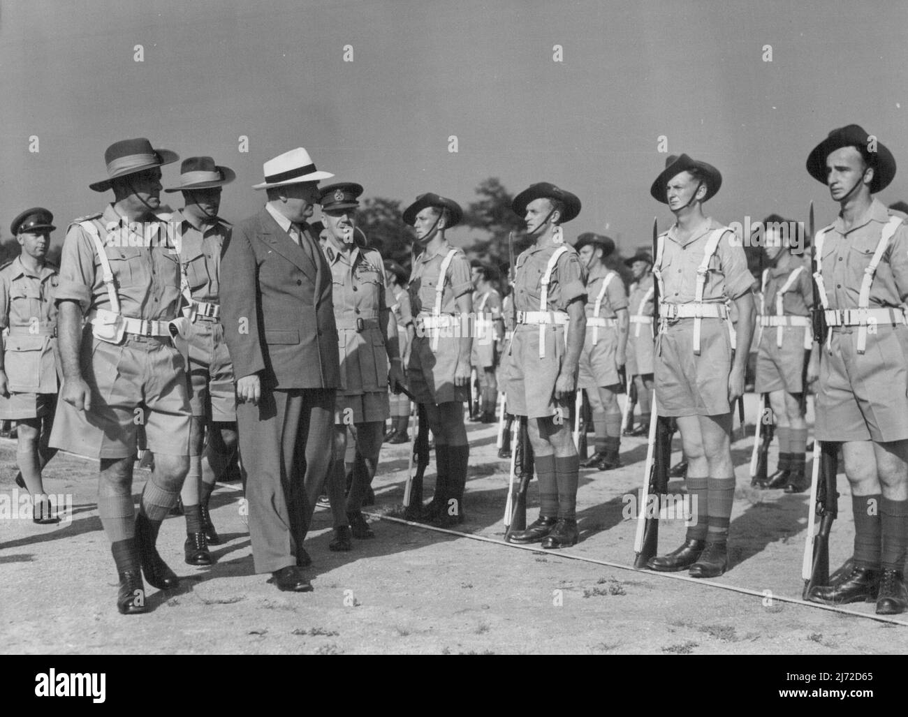 The Rt. Hon. R.G. Menzies inspecting troops of Royal Aust. Army Service Corps. Left to right; Lt. Col. Fairclough commanding officer ***** Col. F.S. Walsh Parade Commander, The Rt. Hon. R.G. Menzies **** C-in-C BCOF Lt. Gen. Sir Horace Robertson. The Australian Prime Minister, The Rt. Hon. R/G. Menzies, today inspected troops of the British Commonwealth Occupations Force at a parade on Anzac Park, Kure, Japan, on 16 Aug. '50. August 16, 1950. Stock Photo