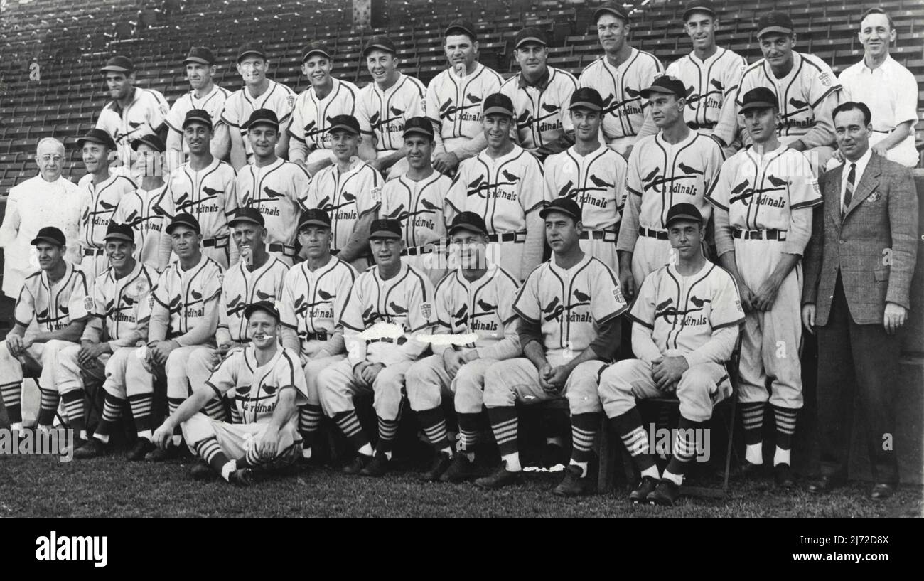 Winners Of 1942 Pennant In The National League -- These are the proud faces of the St. Louis Cardinals, winners of the National League pennant after a sensational home-stretch race in which they clinched the flag from the Brooklyn Dodgers on the final day of the season. Left to right are: Front row, Marty Marion, Stan Musial, John Hopp, Coach Mike Gonzales, Manager Billy Southworth, Coach Buzzy Wares, George Kurowski, Sam Narron and Ken O'Dea; Second row, Dr. H. J. Weaver, trainer; Bill Beckman, Jimmy Brown, Harry Walker, John Beazley, Ernio White, Enos Slaughter, Harrry Gumbert, Howard Pollet Stock Photo