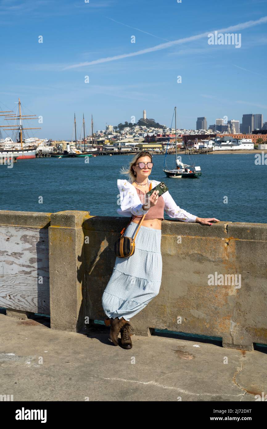 Young Woman Visiting Aquatic Park Pier in San Francisco | Lifestyle Tourism Stock Photo