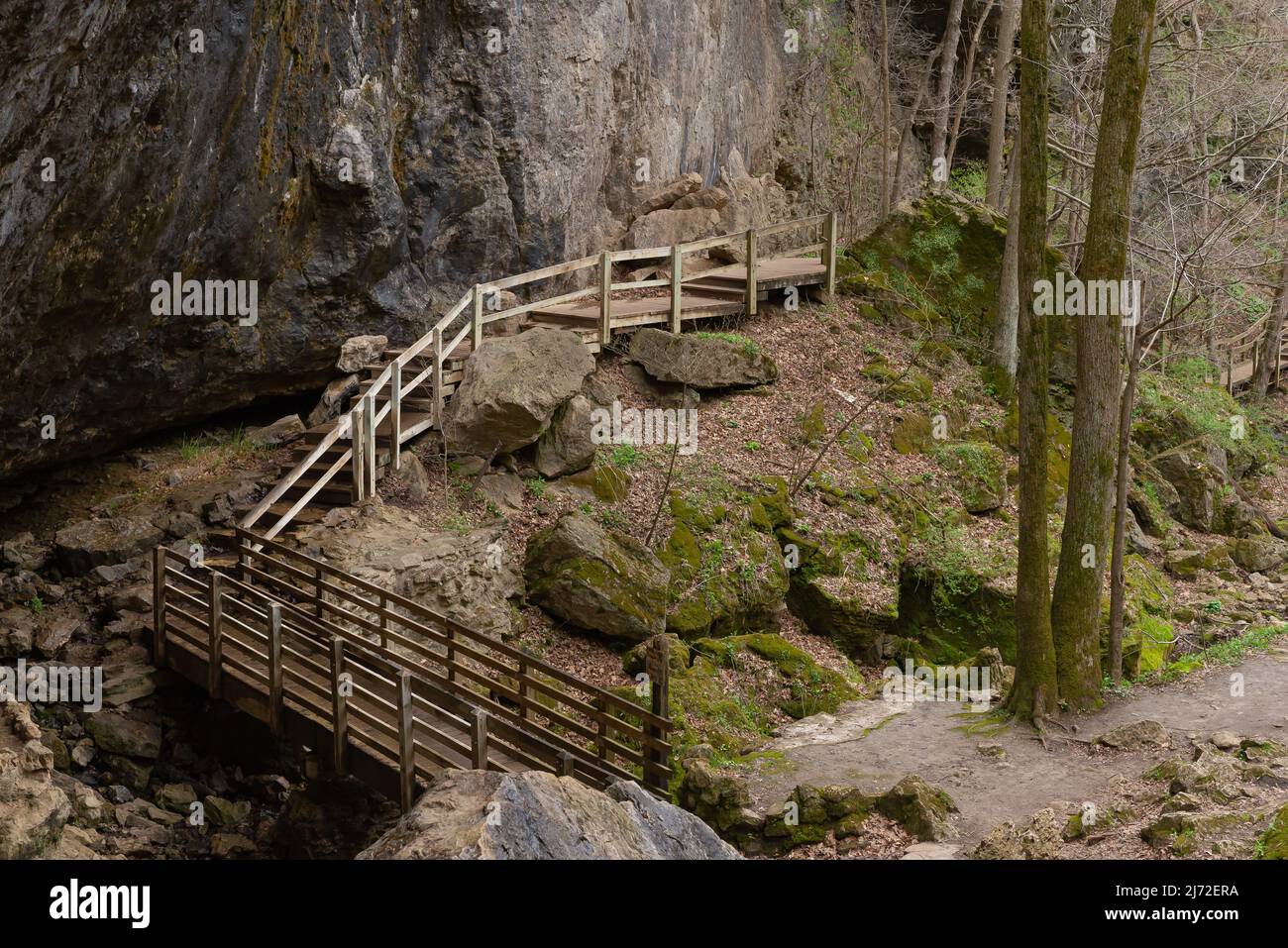 Wooden walkway along the cave walls at the entrance of the Lower Dancehall Cave.  Maquoketa Caves State Park, Iowa, USA. Stock Photo