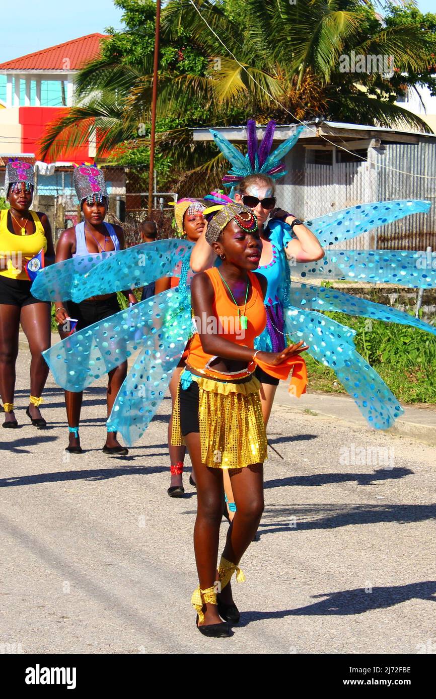 PUNTA GORDA, BELIZE - SEPTEMBER 10, 2015 St. George’s Caye Day celebrations and carnival - troupe leader in orange and blue Stock Photo