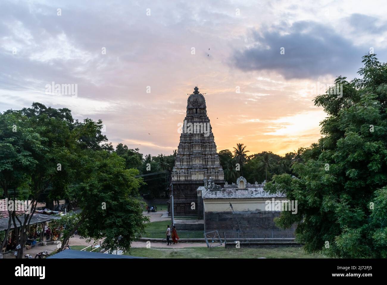 Vellore, Tamil Nadu, India - September 2018: The tower spire of the ancient Hindu Jalakanteswarar temple inside the Vellore Fort complex at sunset. Stock Photo