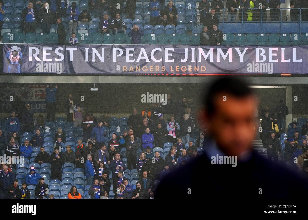 A banner in memory of former Rangers kit man Jimmy Bell, who died aged