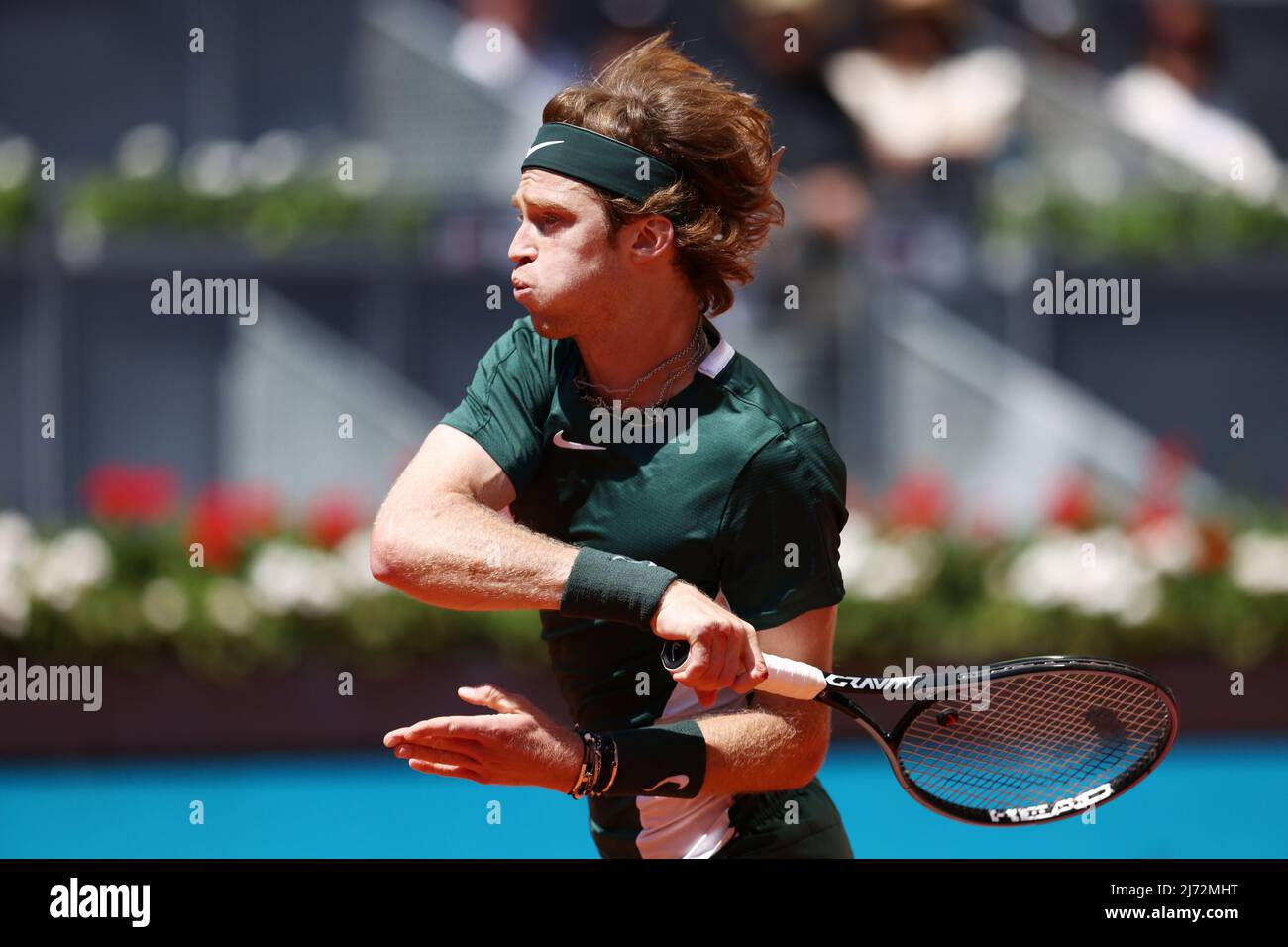 Andrey Rublev of Russia in action against Daniel Evans of Great Britain during the Mutua Madrid Open 2022 tennis tournament on May 5, 2022 at Caja Magica stadium in Madrid, Spain -