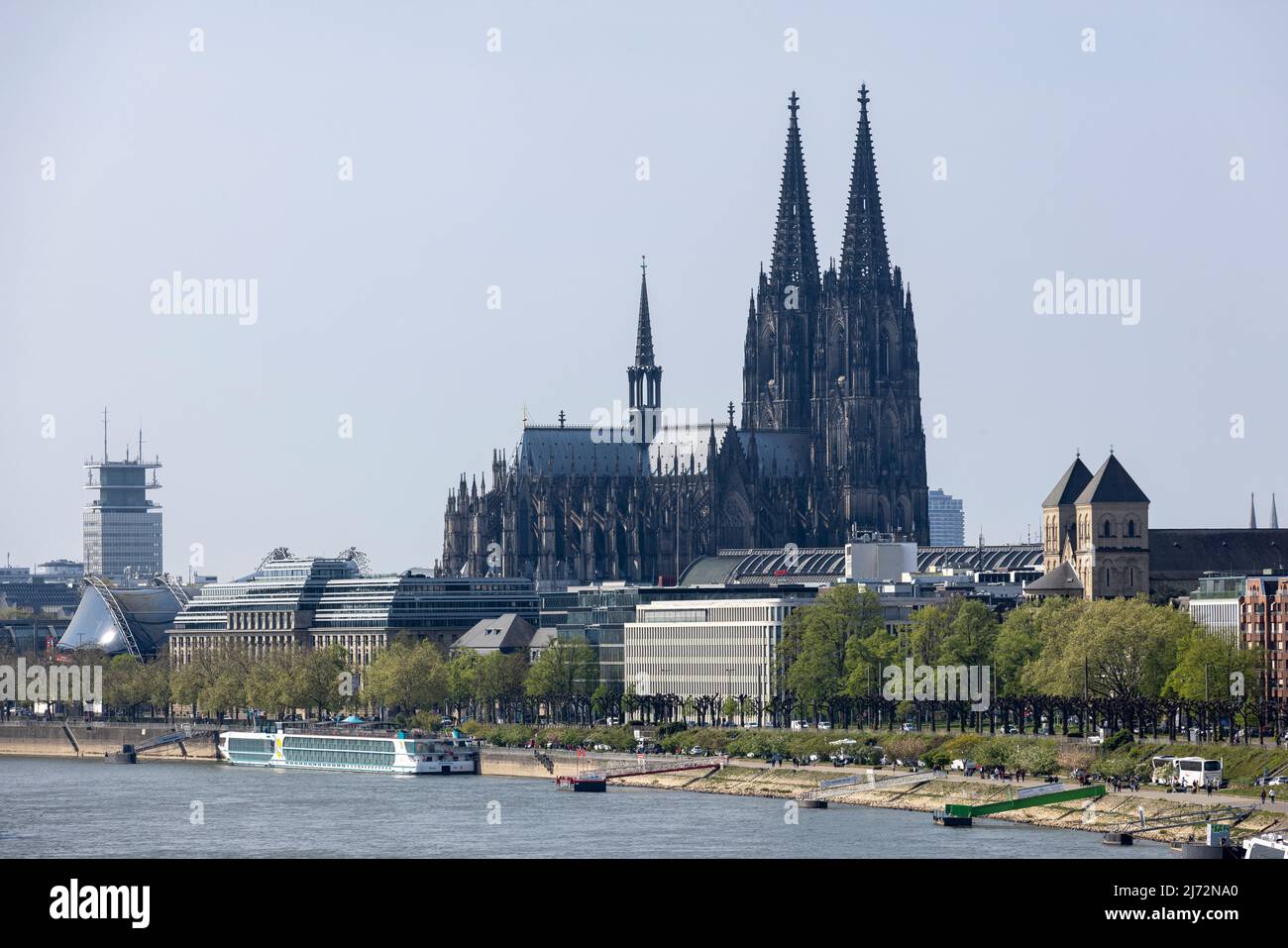 Cologne Cathedral twin towers rising above city skyline on a bright ...