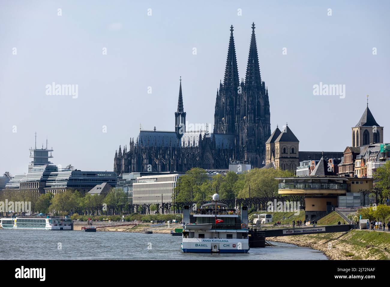 Cologne Cathedral twin towers rising above city skyline on a bright ...