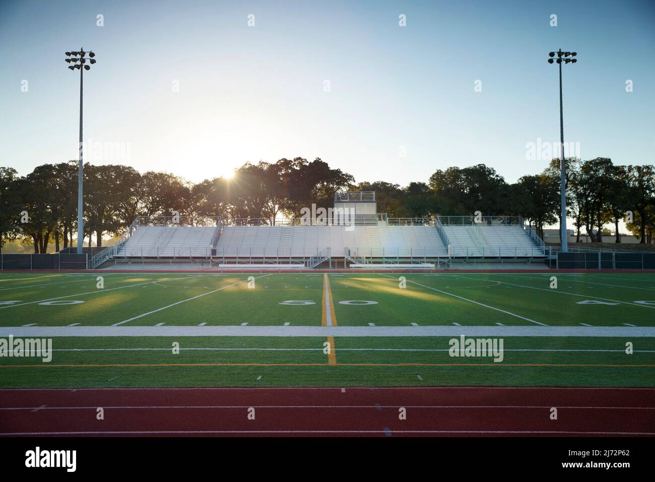 Field level view of a high school track and football field in Texas at