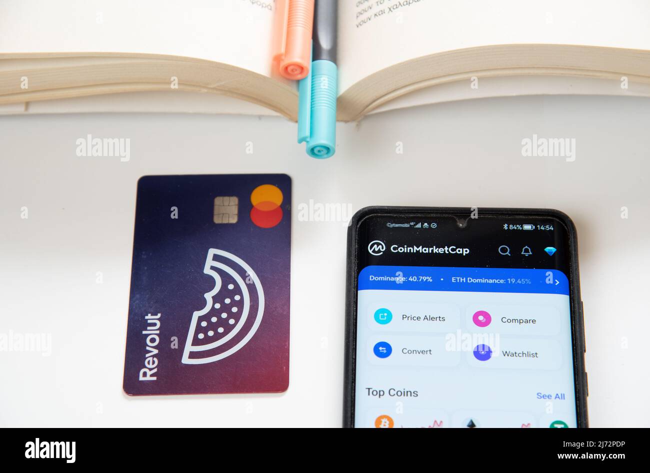 Smartphone revolut debit card. Mobile phone app cryptocurrency trading  online banking Stock Photo - Alamy