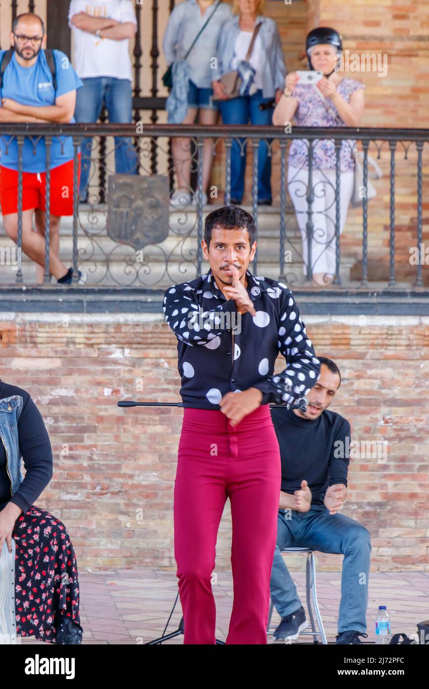 hispanic male flamenco dancer performing to tourists at the Plaza de