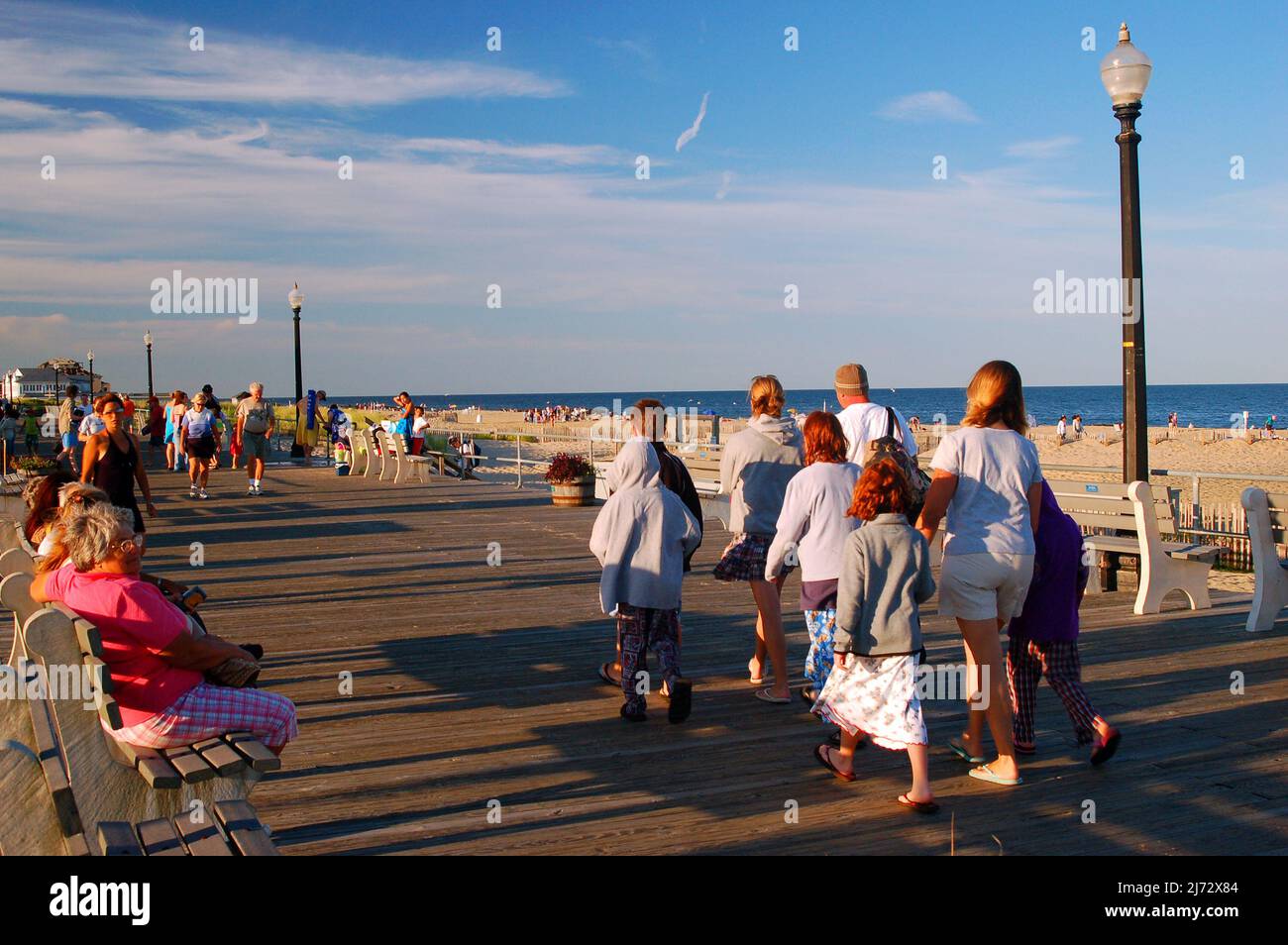 A family enjoys a walk along the Boardwalk in Ocean Grove on the Jersey