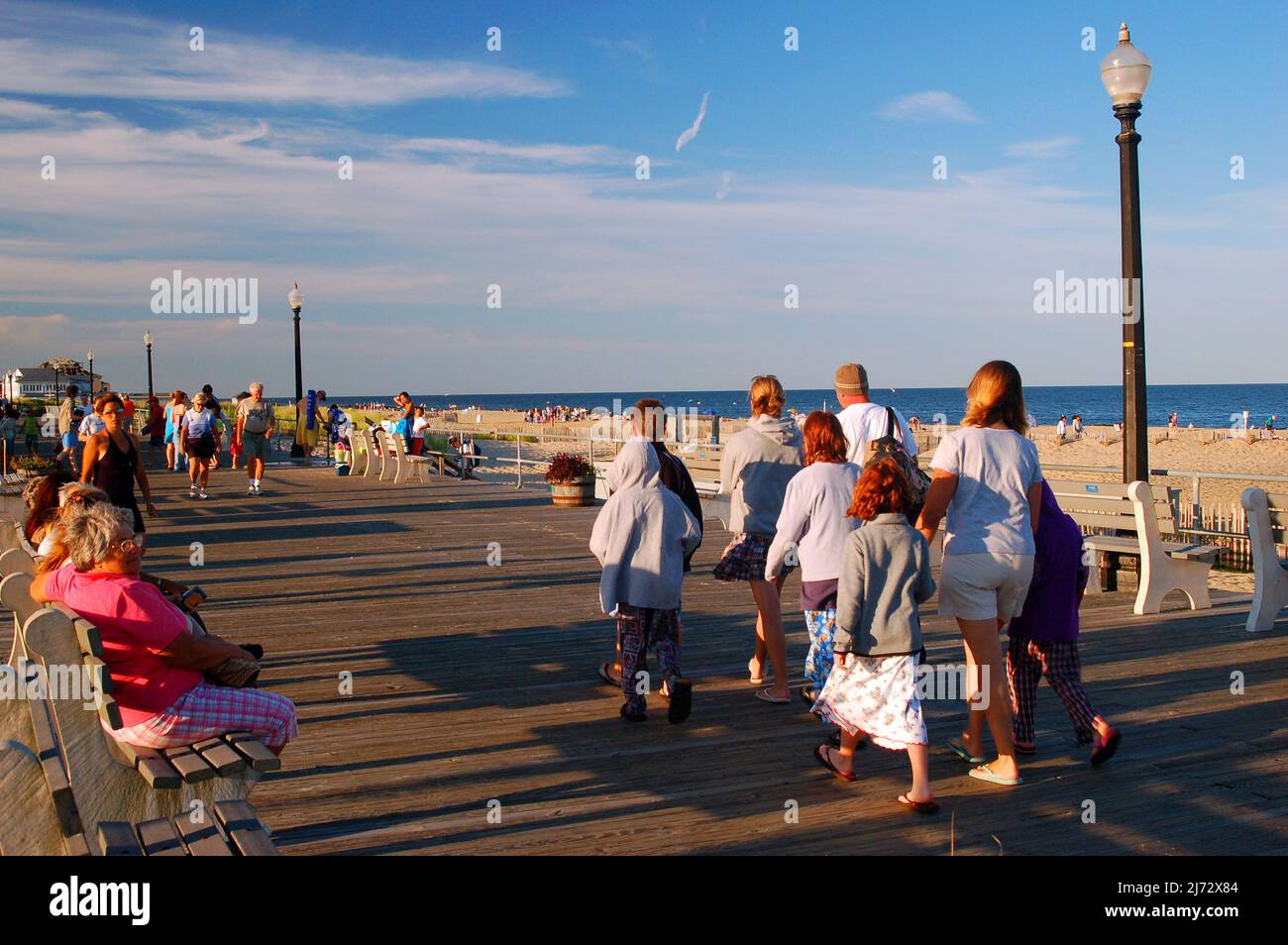 A family enjoys a walk along the Boardwalk in Ocean Grove on the Jersey  Shore Stock Photo - Alamy