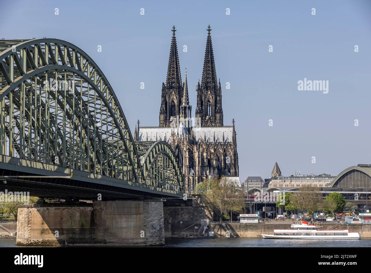 Cologne Cathedral twin towers rising above city skyline on a bright ...