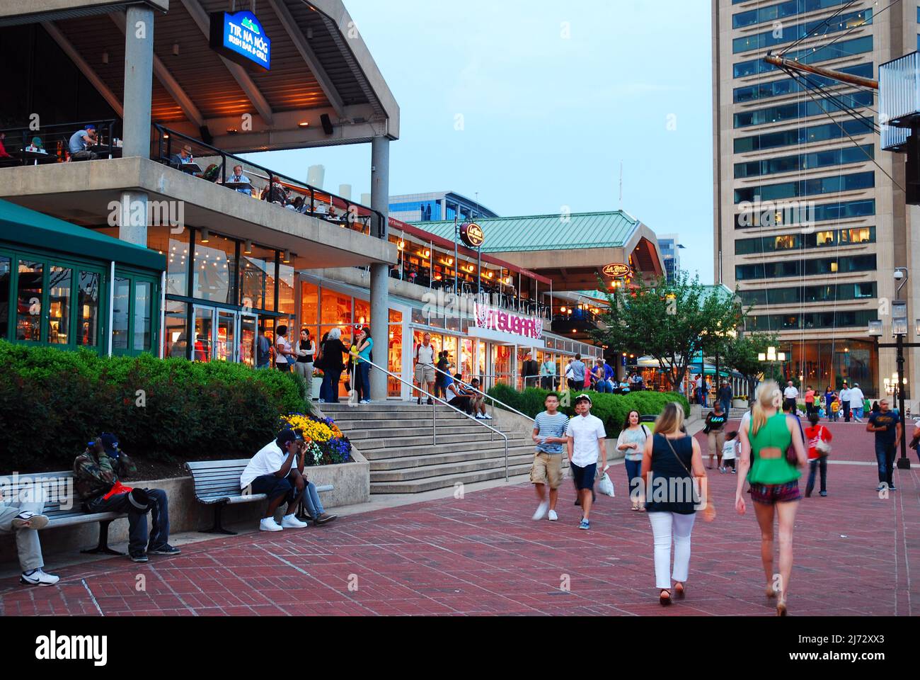Folks walk around the shops and cafes on Inner Habor in Baltimore, Maryland Stock Photo