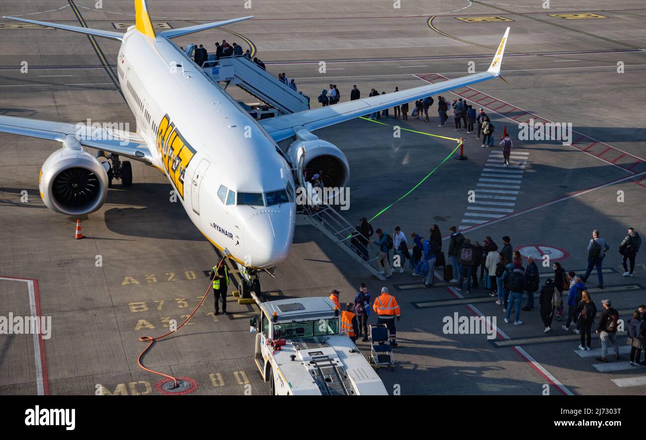 A picture of a Buzz (part of the Ryanair group) plane being boarded