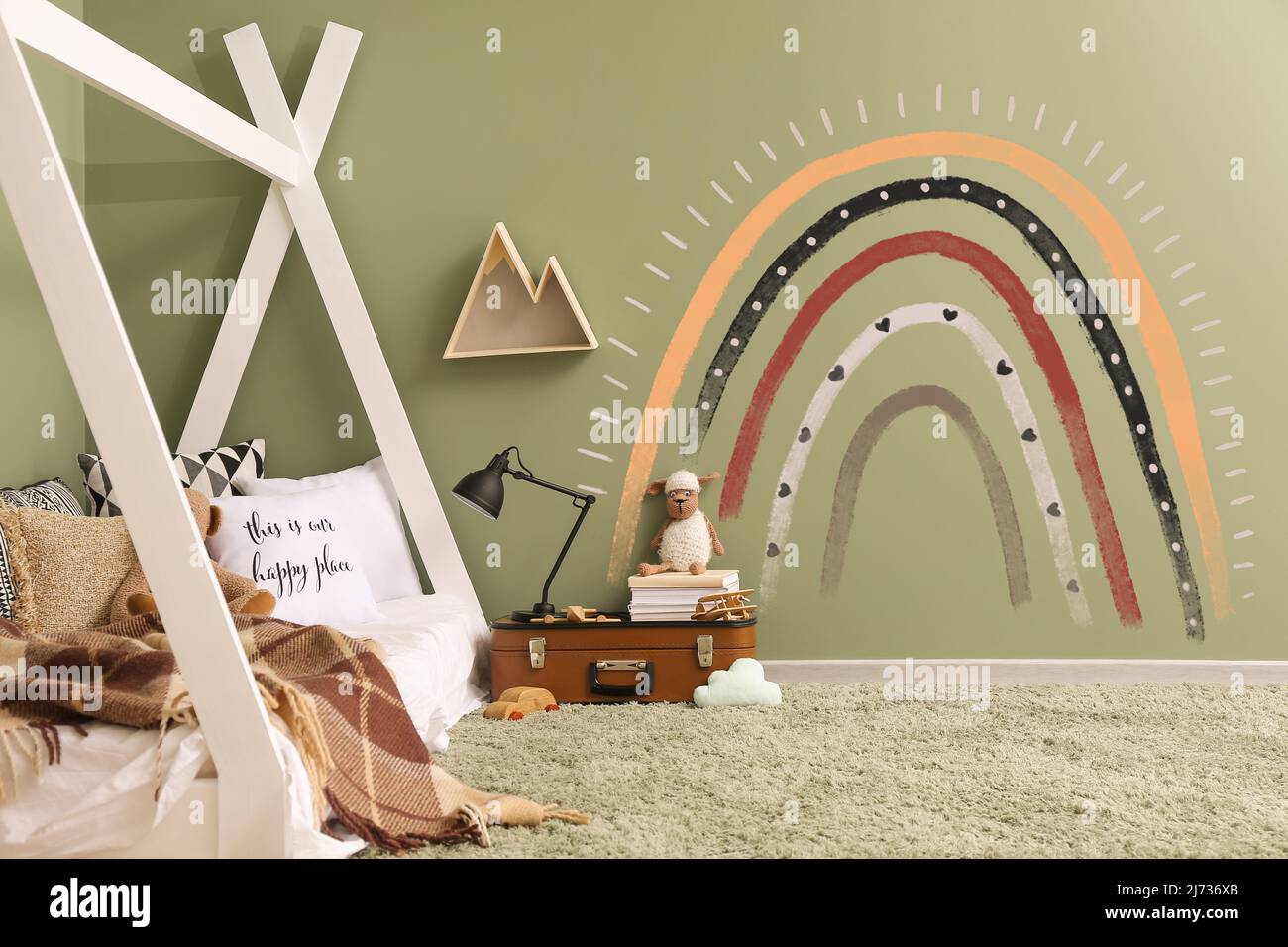 Interior of modern children's room with painted rainbow on wall Stock ...