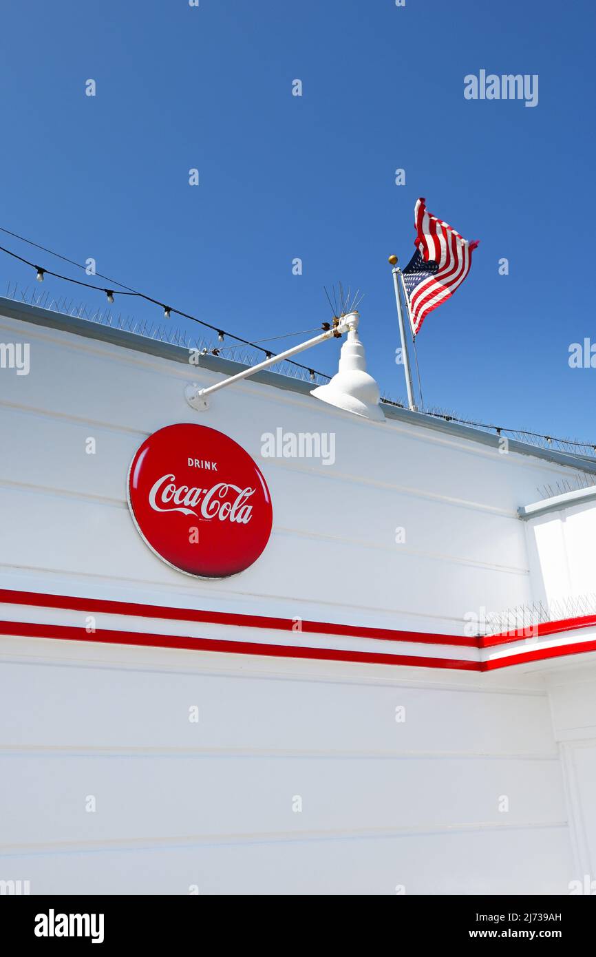 NEWPORT BEACH, CALIFORNIA - 4 MAY 2022: Drink Coca-Cola sign on the Rubys Restaurant at the end of the Balboa Pier. Stock Photo