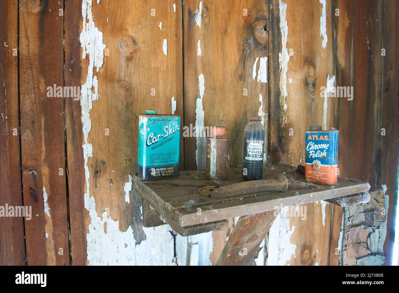 Abandoned cabin in the mountains of Winkleman, Arizona, with left over cans of furniture polish. Stock Photo