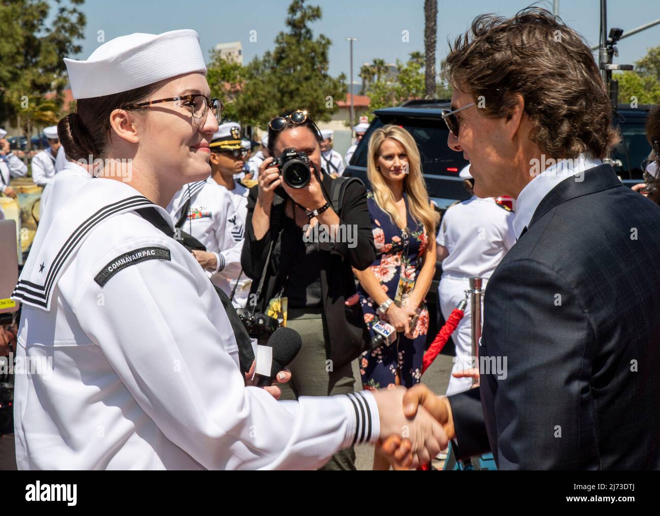 San Diego, United States. 04 May, 2022. American actor Tom Cruise shakes hands with U.S. Navy sailor Chelsea Meiller, left, on the red carpet during the advance movie premiere of Top Gun: Maverick, at Naval Air Station North Island, May 4, 2022 in San Diego, California, Top Gun: Maverick, is the sequel to the 1986 blockbuster, Top Gun and will be released worldwide on May 27.  Credit: MC2 Keenan Daniels/US Navy/Alamy Live News Stock Photo