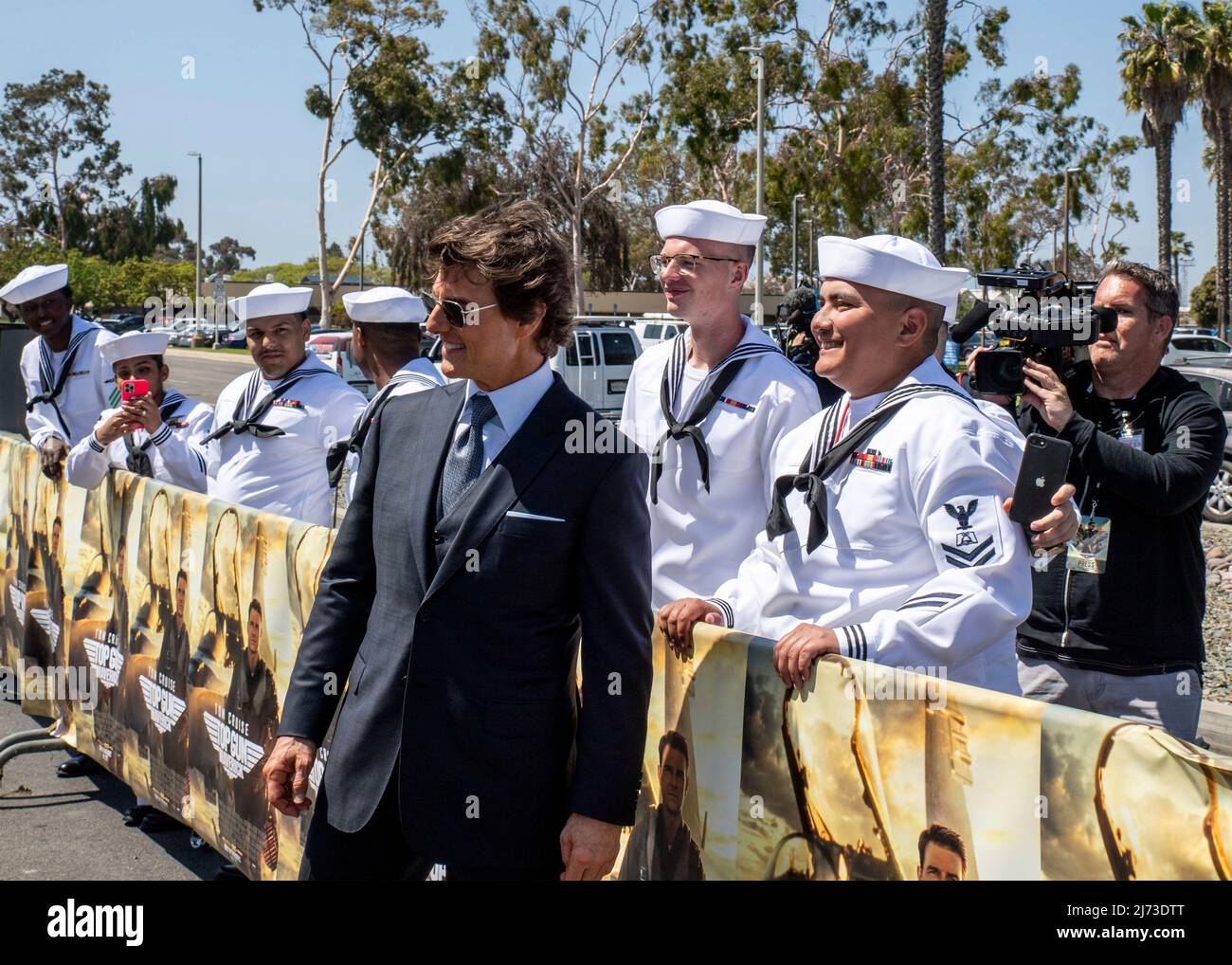 San Diego, United States. 04 May, 2022. American actor Tom Cruise poses with sailors on the red carpet during the advance movie premiere of Top Gun: Maverick, at Naval Air Station North Island, May 4, 2022 in San Diego, California, Top Gun: Maverick, is the sequel to the 1986 blockbuster, Top Gun and will be released worldwide on May 27.  Credit: MC2 Keenan Daniels/US Navy/Alamy Live News Stock Photo