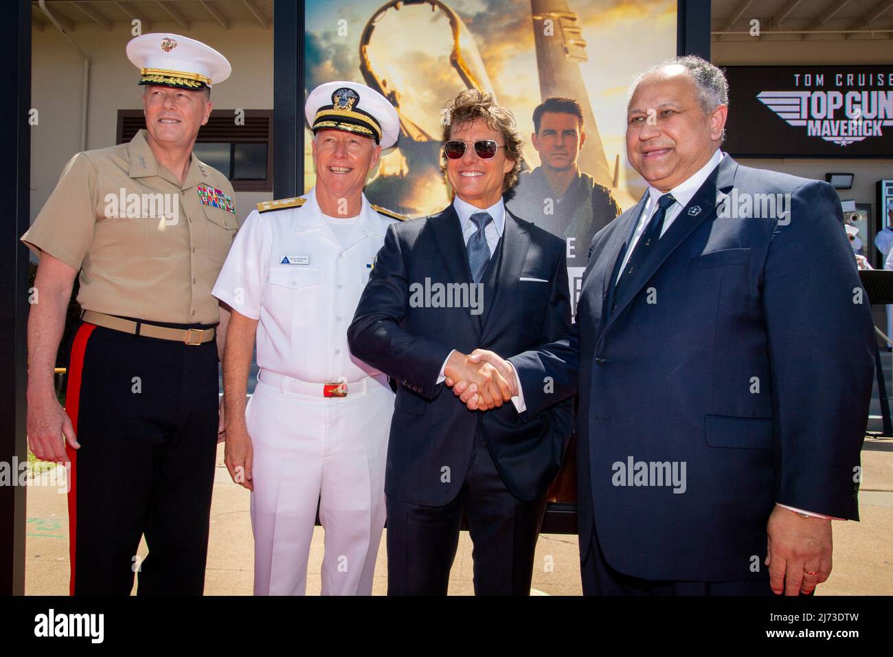 San Diego, United States. 04 May, 2022. U.S. Secretary of the Navy Carlos Del Toro, right, shakes hands with American actor Tom Cruise, center, alongside  Lt. Gen. Mark Wise, left, and Vice Adm. Kenneth Whitesell, on the red carpet during the advance movie premiere of Top Gun: Maverick, at Naval Air Station North Island, May 4, 2022 in San Diego, California,  Credit: MC2 Olympia McCoy/US Navy/Alamy Live News Stock Photo