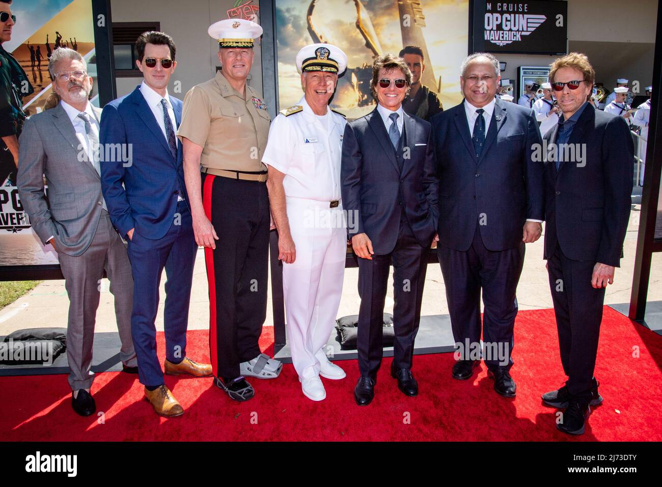 San Diego, United States. 04 May, 2022. American actor Tom Cruise, center, poses on the red carpet during the advance movie premiere of Top Gun: Maverick, at Naval Air Station North Island, May 4, 2022 in San Diego, California. From left, Chris McQuarrie, Joe Kosinski, Lt. Gen. Mark Wise, Vice Adm. Kenneth Whitesell, Tom Cruise, Secretary of the Navy Carlos Del Toro, and Jerry Bruckheimer.  Credit: MC2 Olympia McCoy/US Navy/Alamy Live News Stock Photo