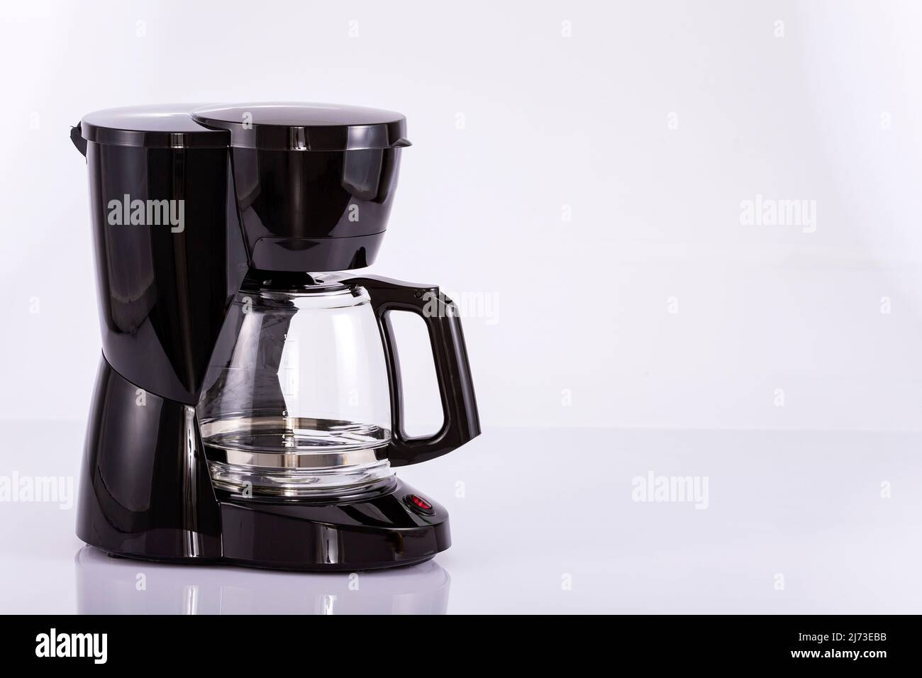 Automatic electric coffee maker on white background Stock Photo Alamy