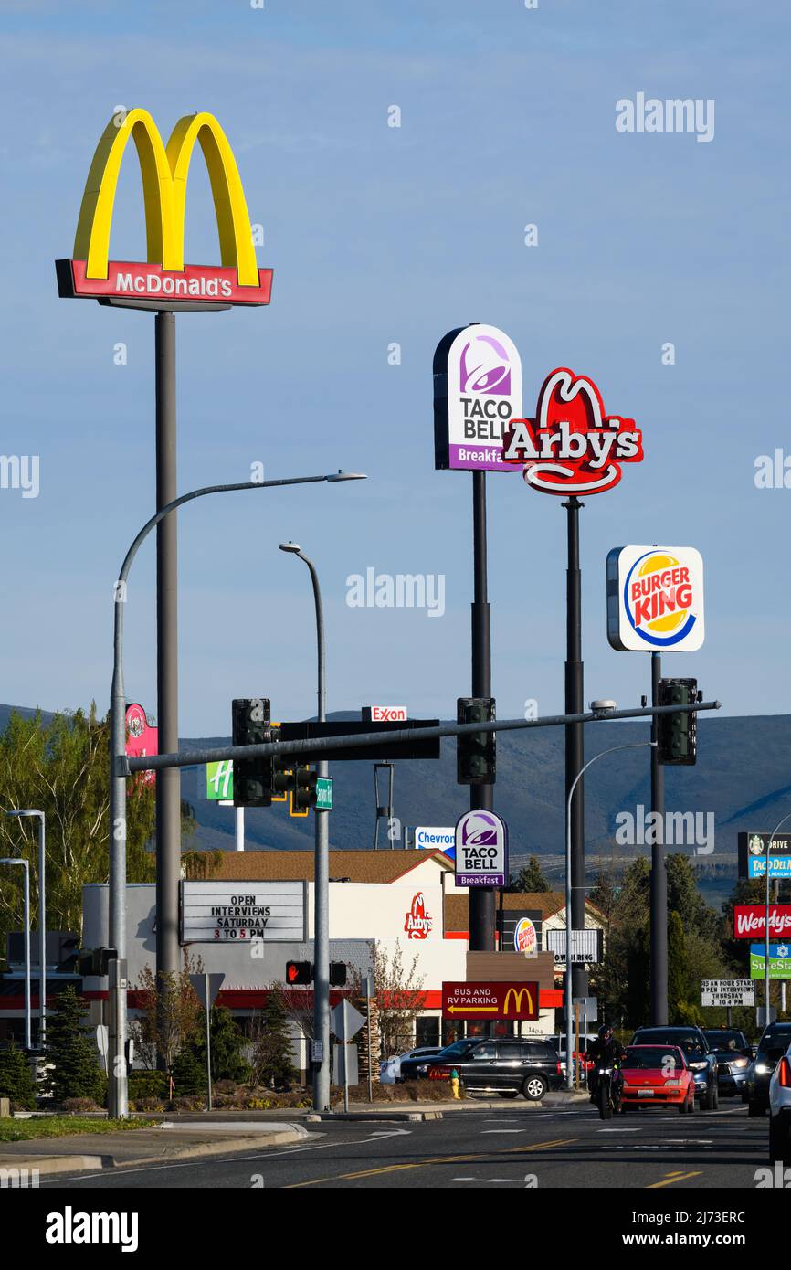 Ellensburg, WA, USA - May 04, 2022; Tall fast food signposts on Canyon Road near junction of I90 and I82 in Ellensburg Washington Stock Photo