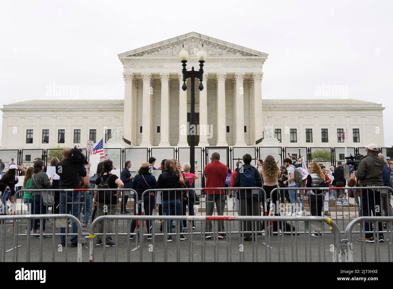 Abortion Right demonstrators hold placards in front of the Supreme Court about the leak of a draft opinion that would overturn the landmark 1973 Roe v. Wade decision during a rally at US Supreme Court in Washington DC, USA. Stock Photo