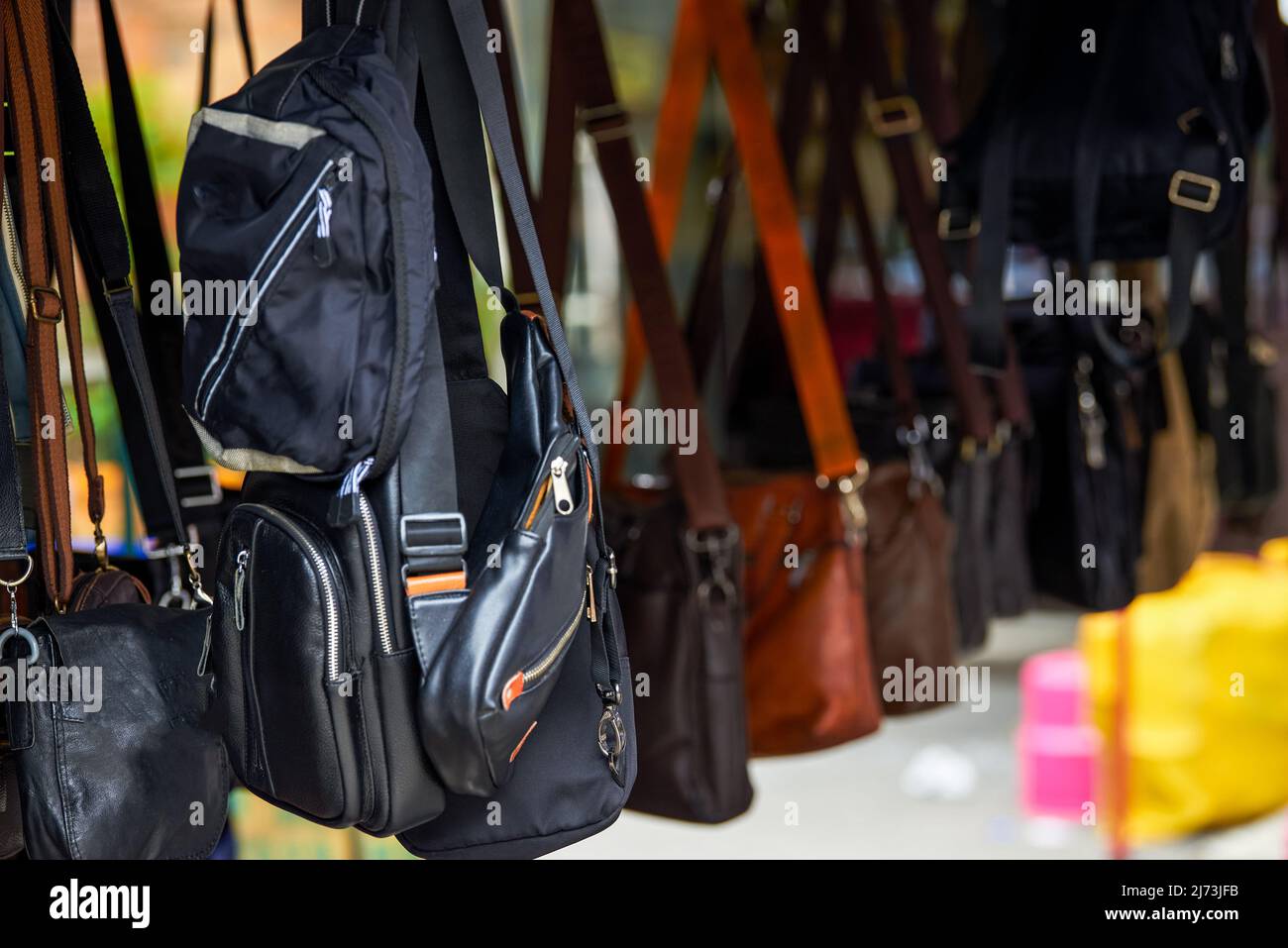 Various shoulder and messenger bags on the market Stock Photo