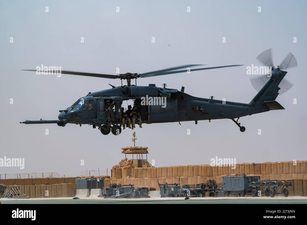 U.S. Air Force Pararescuemen, assigned to the 52nd Expeditionary Rescue Squadron, take off in an HH-60 Pave Hawk, assigned to the 46th ERQSs, for a combat search and rescue exercise at an undisclosed location, April 28, 2022. Air Forces Central Command's ERQSs are organized, trained, equipped, and postured to conduct full spectrum personnel recovery to include both conventional and unconventional combat rescue operations within the Central Command theater of operations. (U.S. Air Force photo by Staff Sgt. Christian Sullivan) Stock Photo