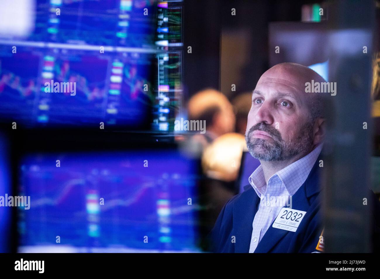 (220506) -- NEW YORK, May 6, 2022 (Xinhua) -- A trader works on the floor of the New York Stock Exchange (NYSE) in New York, the United States, May 5, 2022. U.S. stocks plunged on Thursday as heavy selling intensified on Wall Street.   The Dow Jones Industrial Average tumbled 1063.09 points, or 3.12 percent, to 32,997.97. The S&P 500 fell 153.30 points, or 3.56 percent, to 4,146.87. The Nasdaq Composite Index shed 647.17 points, or 4.99 percent, to 12,317.69. (Photo by Michael Nagle/Xinhua) Stock Photo