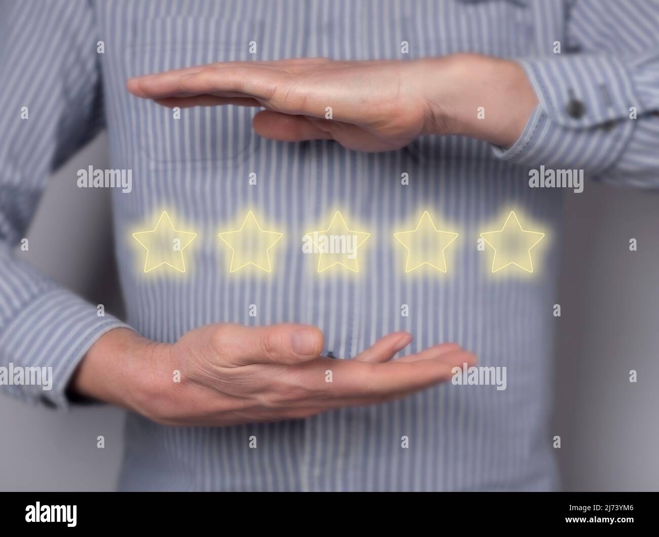 Five star review. Man ranking service quality, film, restaurant, hotel. Customer feedback showing satisfaction concept. High quality photo Stock Photo