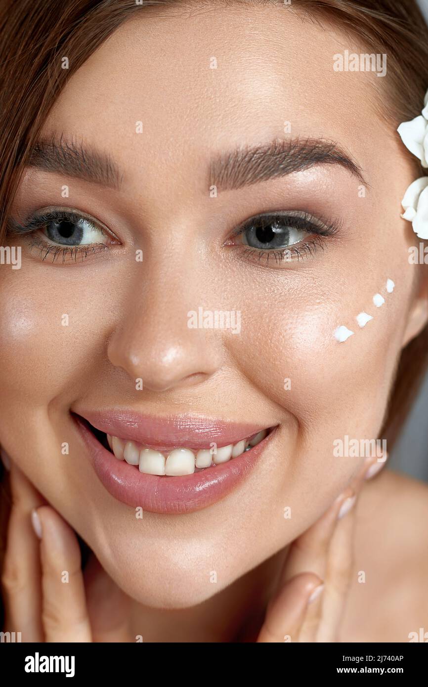 Beauty woman about to apply face cream. Holding Moisturizing Lotion