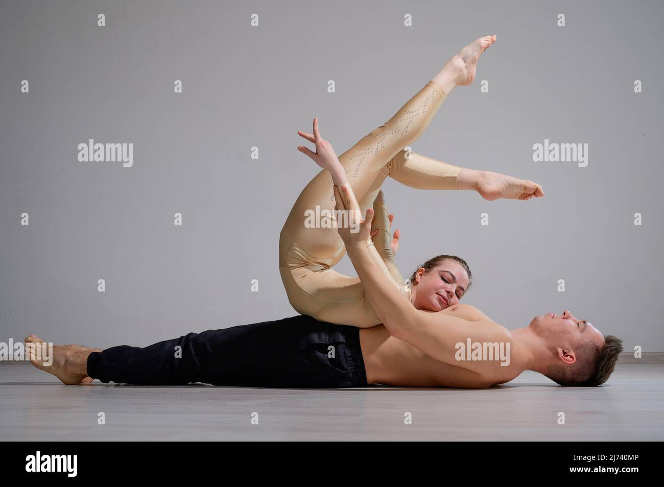 Two Women Finding Balance In A Yoga Pose by Stocksy Contributor ISO DUO -  Stocksy, duo yoga poses - thirstymag.com